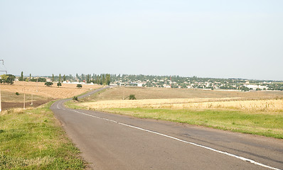 Image showing a turn of rural road is to the right