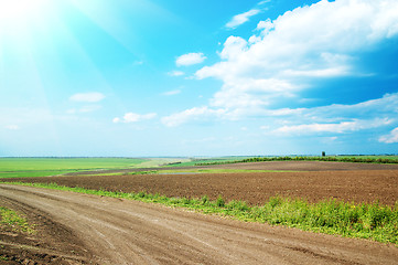 Image showing dirty road under cloudy sky