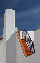 Image showing Detail of white house under blue sky 