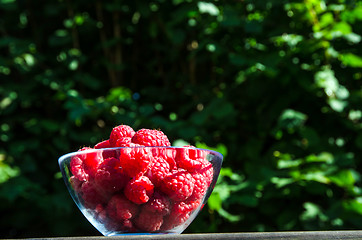 Image showing Glass bowl with raspberries