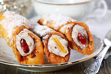Image showing Roll with cream and candied fruit.