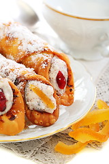 Image showing Cannoli and candied oranges. 