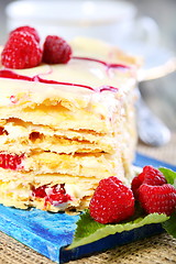 Image showing Puff pastry with cream and raspberries.