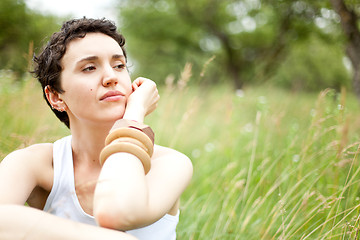 Image showing cute girl on green field 