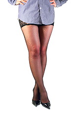 Image showing Shapely female legs in black stockings.