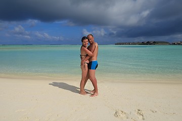 Image showing happy young couple have fun on beach