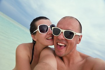 Image showing happy young couple have fun on beach