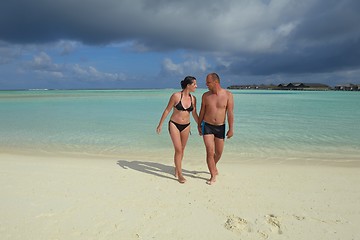 Image showing happy young couple have fun on beach