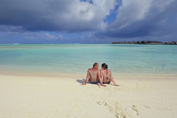 Image showing happy young couple have fun on beach