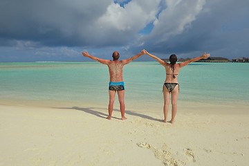 Image showing happy young couple have fun on beach