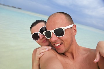 Image showing happy young couple have fun on beach