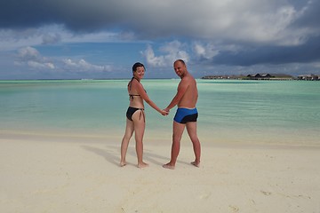 Image showing happy young couple have fun on beach