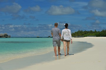 Image showing happy young couple have fun on beach