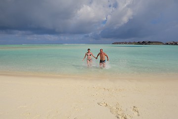 Image showing happy young couple have fun on beach