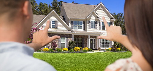 Image showing House and Military Couple Framing Hands in Front