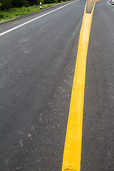 Image showing yellow line on the road texture background