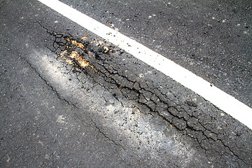 Image showing Old cracked asphalt