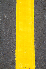 Image showing yellow line on the road texture background