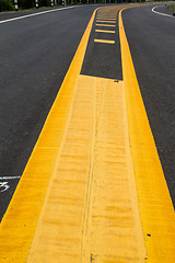 Image showing yellow line on the road texture background