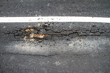 Image showing Old cracked asphalt