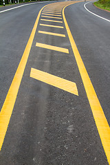 Image showing yellow line on the road texture background