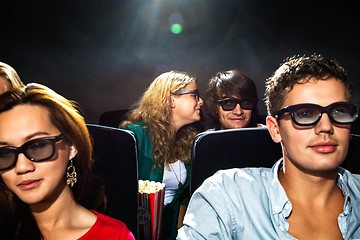 Image showing Woman Whispering In Boyfriend's Ear In Cinema Theatre