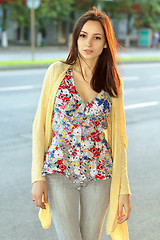 Image showing Pretty brunette in flowered blouse