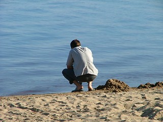 Image showing lonely guy in the beach