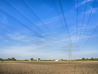 Image showing Power calbe over a field