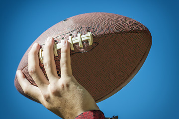 Image showing hand with american football