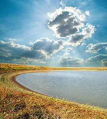 Image showing pond under cloudy sky