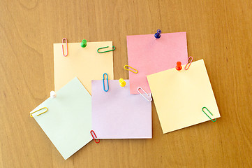 Image showing five sticker notes with pins and clips
