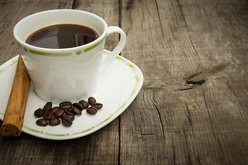 Image showing Coffee Cup with beans and cinnamon stick
