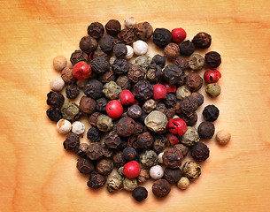 Image showing mix of peppers macro on wooden board