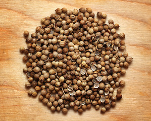 Image showing seeds of coriander macro on wooden board