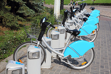 Image showing bicycles in row on parking for rental