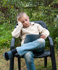 Image showing Kid with tablet pc.