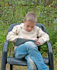 Image showing Kid with tablet pc.