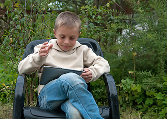 Image showing Kid with tablet pc.