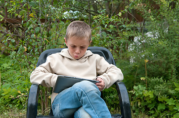 Image showing Kid with tablet pc.