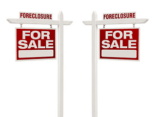 Image showing Two Foreclosure For Sale Real Estate Signs with Clipping Path