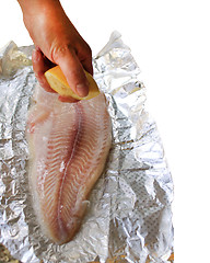 Image showing cooking of dish with mackerel with lemon juice