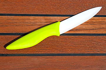 Image showing Ceramic knife on a cutting board