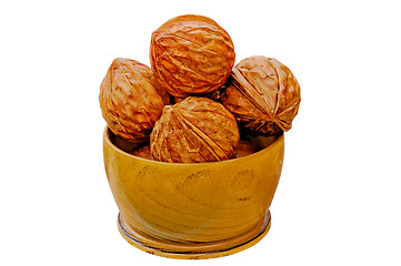 Image showing Walnuts from juniper wood in a vase