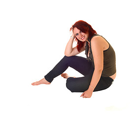 Image showing Girl sitting on floor.