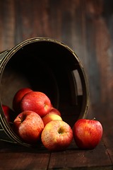 Image showing Barrel Full of Red Apples on Wood Grunge  Background