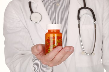 Image showing Doctor With Medication in Prescription Bottles