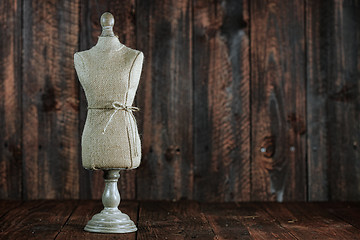 Image showing Antique Mannequin Busts on Wood Grunge Background