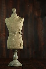 Image showing Antique Mannequin Busts on Wood Grunge Background