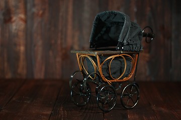 Image showing Baby Cradle on Grunge Wooden Background